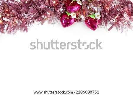 Blue tinsel and Christmas tree toys hearts on a White background