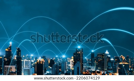 Smart digital city with connection network reciprocity over the cityscape . Concept of future smart wireless digital city and social media networking systems that connects people within the city . Royalty-Free Stock Photo #2206074129