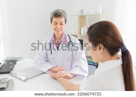 asian doctor use hand screening pulse rate and vital sign of patient, doctor treatment patient in hospital, adult health check up , they talking about disease symptom