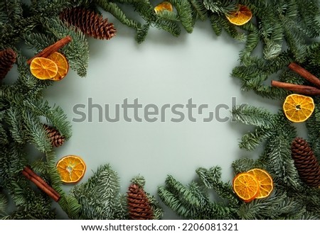Christmas holiday background with copy space for text. Fir tree branches with Christmas balls frame.