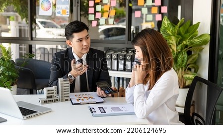 Sales giving male customer signing sales contract, Asian woman and man doing business in office, business concept and contract signing. in office
