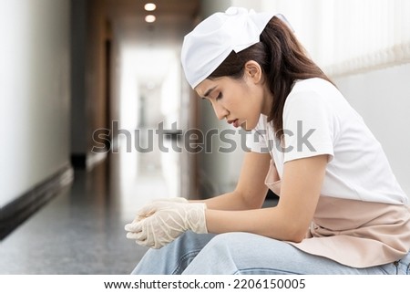 Burnout low wage immigrant worker, woman cleaner having problem with working condition or being fired, concept of too low wage or unemployment, layoff Royalty-Free Stock Photo #2206150005