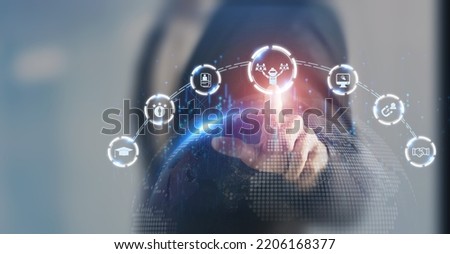 AI recruiting technology concept. Using artificial intelligence in the talent acquisition process. A robot choosing business people to hire. HR technology ecosystem strategies for HR professionals. Royalty-Free Stock Photo #2206168377