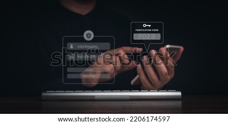 Two steps authentication or 2FA concept. 2023 Verification code and key icon on smart phone screen with keyboard computer for validate password page, Identity verification, cyber security technology. Royalty-Free Stock Photo #2206174597