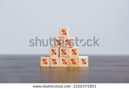 Closeup wood cubes with percentage symbol, business interest, discount investment, financial growth, interest rate increase, sale price and tax rise, future gain, market digital concept