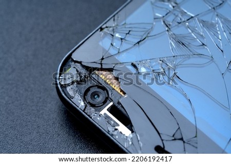 Broken smartphone screen close up view, macro photography. Phone repair and renovation background.