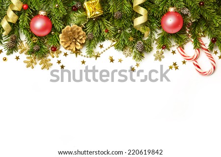 Christmas tree branches with red baubles,  golden stars, snowflakes isolated on white  -  horizontal border