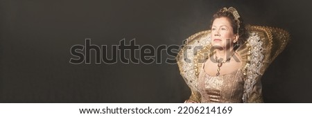 Banner with portrait of the image of Queen Elizabeth I of the 16th century. Historical reconstruction. The image of the queen in smoke on a dark brown background with copy space. High quality photo