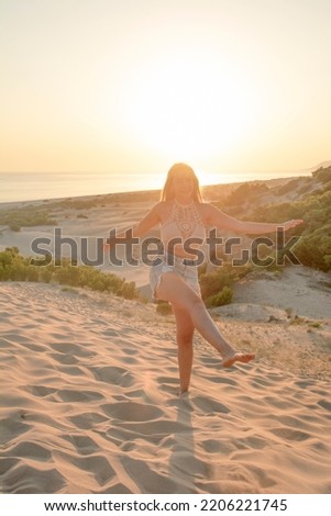 Happy traveler woman joy relaxing on summer vacation at sunset