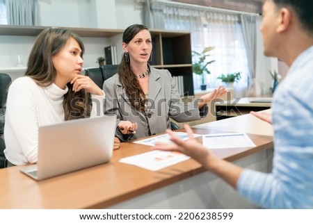 business caucasian and asian woman interview. annoyed human resource from industry having interview with employee candidate but disappointed. a new recruitment argument with uncomfortable employer. Royalty-Free Stock Photo #2206238599