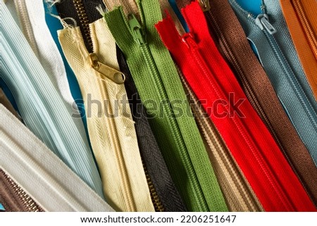 Collection of zippers of different colors and variants