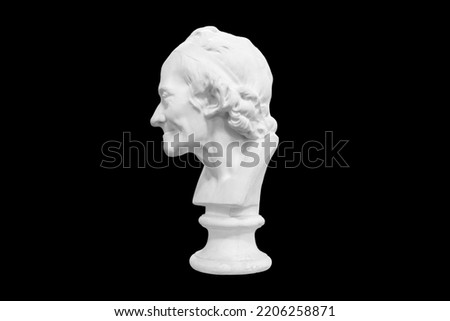 plaster sculpture of a man isolated on a black background. High quality photo