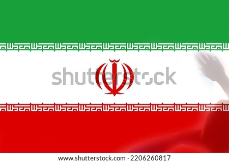 Defocus protest in Iran. Conflict war over border. Country flag. Woman low rights. Male hands.  Iranian women. Violence Iran. Out of focus.