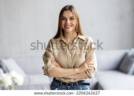 Head shot portrait young woman sitting on couch looking at camera having conversation using computer webcam modern tech talking with friend, girl recording vlog passing job interview distantly concept Royalty-Free Stock Photo #2206262627