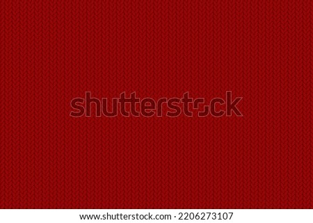 Texture of knitted fabric. Cozy red knitting pattern Royalty-Free Stock Photo #2206273107