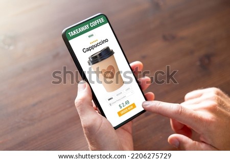 Person ordering coffee online for takeaway on mobile phone Royalty-Free Stock Photo #2206275729