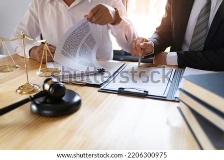 Attorneys or lawyers who are reading the statute of limitations Consultation between male lawyers and business clients, tax and legal and legal services firms.	

 Royalty-Free Stock Photo #2206300975