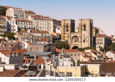 Lisbon, capital city of Portugal. Cityscape with Lisbon Cathedral, the Sé de Lisboa. Rooftop view over historic downtown Lisbon at golden hour sunset. Royalty-Free Stock Photo #2206308117