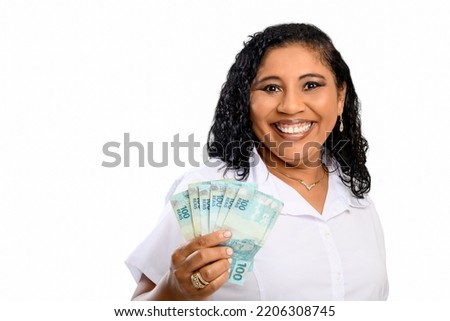 woman holds money, Brazilian, BRL	