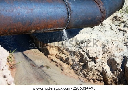 The water broke through an iron pipe (busted water main). Lack of water saving, loss of drinking water Royalty-Free Stock Photo #2206314495