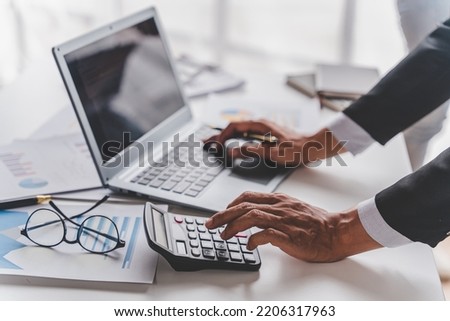 Young colleagues having great business conversations in a modern coworking office. Teamwork concept. Horizontal blurry background. Fireworks. Royalty-Free Stock Photo #2206317963