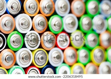 Closeup of pile of used alkaline batteries. Close up colorful rows of selection of AA batteries energy abstract background of colorful batteries. Alkaline battery aa size. Several batteries in rows. Royalty-Free Stock Photo #2206318495
