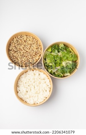 Three poke with quinoa, rice and green salad on white background