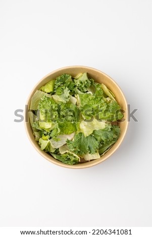 Poke with green salad on white background