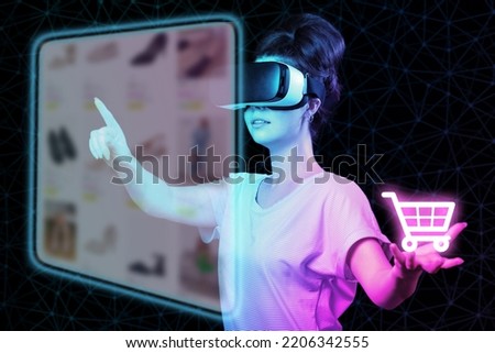 A young woman in VR glasses choice clothes at internet shop point at digital screen, holding neon virtual cart. Dark background. The concept of virtual reality, metaverse and online shopping. Royalty-Free Stock Photo #2206342555