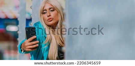 girl with mobile phone making selfie or recording