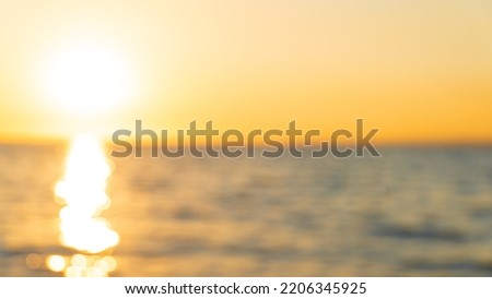 Blurry sunset photography. Blurry sunray background or wallpaper. Golden hour at sunset concept. Royalty-Free Stock Photo #2206345925