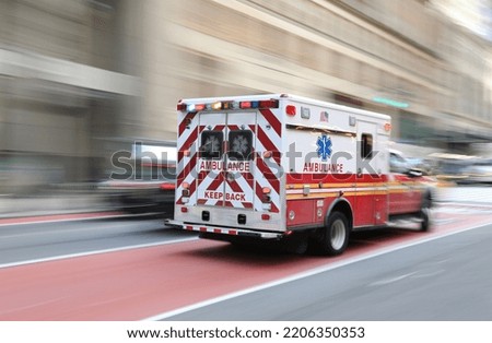 Ambulance on emergency vehicle in motion blur Royalty-Free Stock Photo #2206350353