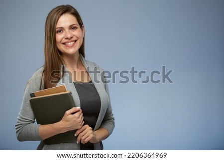 Happy teacher with book. isolated female portrait.