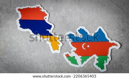 Flags of Armenia and Azerbaijan, The current contours of the countries on a gray background, The concept of tense relations and border conflict Royalty-Free Stock Photo #2206365403