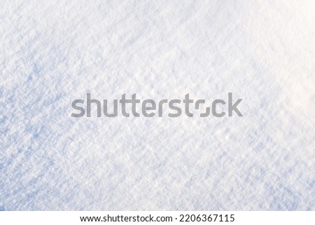 Snow background, top view. Fresh snowy texture. Winter backdrop for publication, poster, calendar, post, screensaver, wallpaper, postcard, cover, website. High quality photography