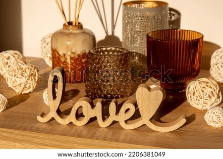 Wooden word love with heart romance. Hard shadows Minimal concept of greeting card for Valentine's Day, Mother's Day, Women's Day Festive banner holiday card concept. Wedding decor.
