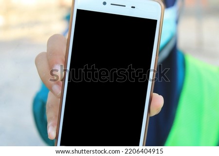 smartphone with black screen in woman's hand