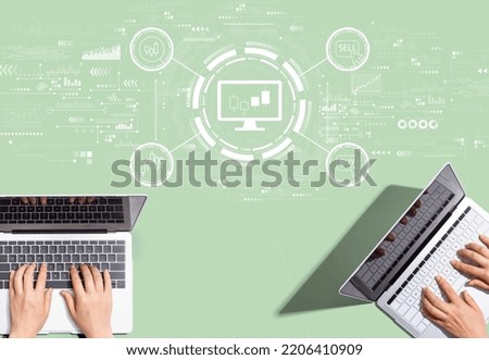 Stock trading theme with people working together with laptop computers