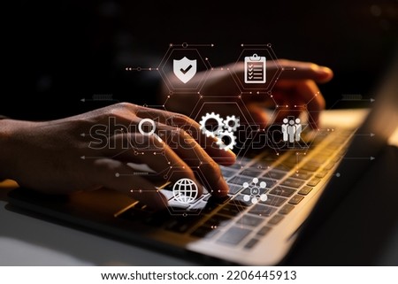 Coding software developers work with augmented reality dashboard computer icons with responsive cybersecurity. Royalty-Free Stock Photo #2206445913