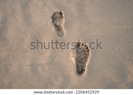 footprints on the sand beach bali