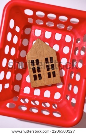 A studio photo of toy wooden houses