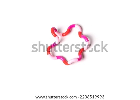 Snake toy puzzle isolated on white background. High quality photo