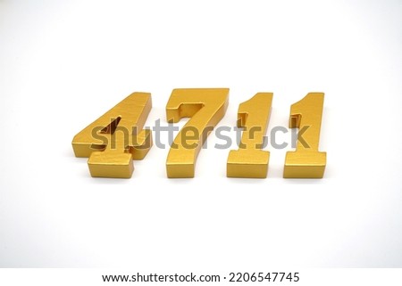   Number 4711 is made of gold-painted teak, 1 centimeter thick, placed on a white background to visualize it in 3D.                               