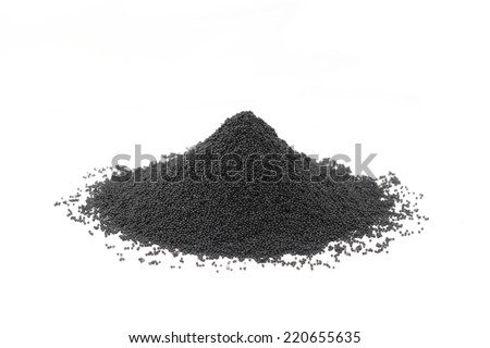 Handful of granular carbon powder on white background  Royalty-Free Stock Photo #220655635