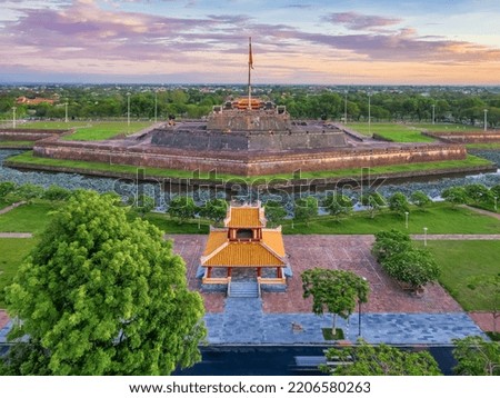 Wonderful view of the “ Meridian Gate Hue “ and Vietnam flag to the Imperial City with the Purple Forbidden City within the Citadel in Hue, Vietnam. Imperial Royal Palace of Nguyen dynasty in Hue. 