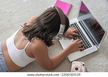 Young girl studying with laptop