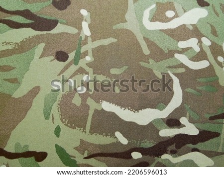 texture of camouflage fabric of the Ukrainian military. Texture of multicam fabric.

