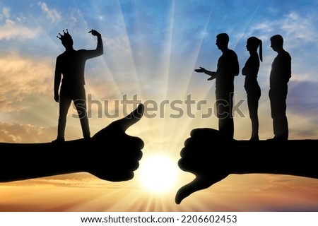Selfishness and ego. An arrogant selfish man with a crown, considers himself better than other people. The concept of egoism and arrogance. Silhouette Royalty-Free Stock Photo #2206602453