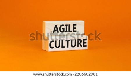 Agile culture symbol. Concept words Agile culture on wooden blocks. Beautiful orange table orange background. Business flexible and agile culture concept. Copy space.
