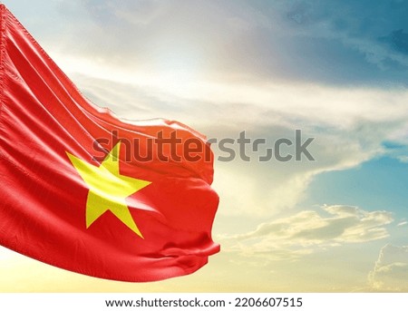 Vietnam national flag waving in beautiful sky.